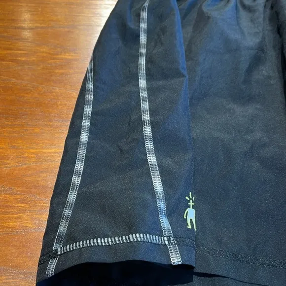 Smartwool PhD black tennis skirt with interior wool shorts Large