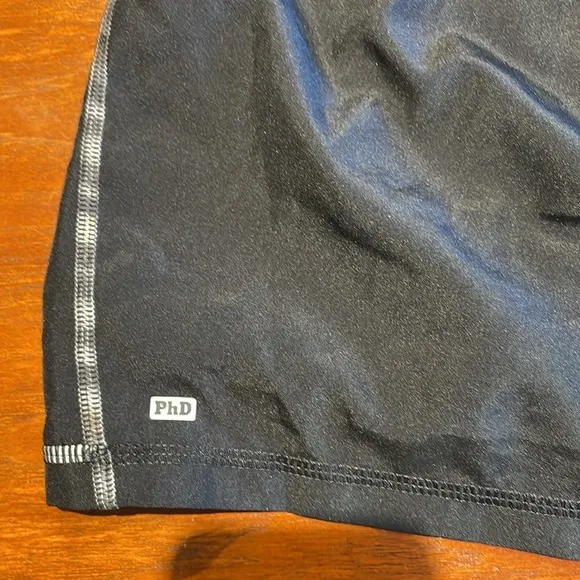 Smartwool PhD black tennis skirt with interior wool shorts Large